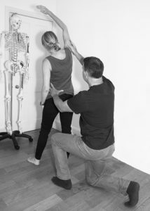 Hugo Firth Registered Osteopath treating neck pain in his Kingston clinic 